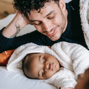 father looks fondly at infant son 528