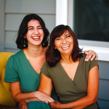 mother-young-adult-daughter-sitting-on-porch-3033
