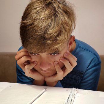 preteen-teen-boy-bored-at-school-1289