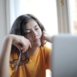 teen girl staring at computer screen distraction adhd 1070