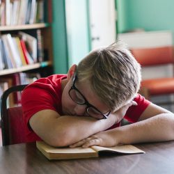 tired-young-boy-library-367