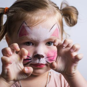 toddler with face paint playing pretend imagination 269