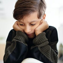 young-boy-concentrating-on-reading-361