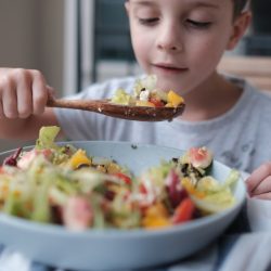 young boy with salad healthy food 1125