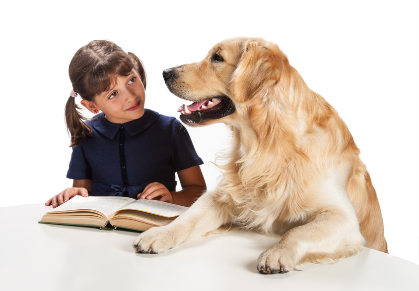 child reads to dog